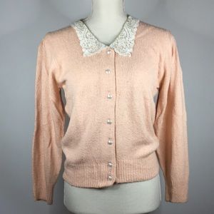 Cardigan Sweater: pale coral color, cream lace collar, Pearl buttons.